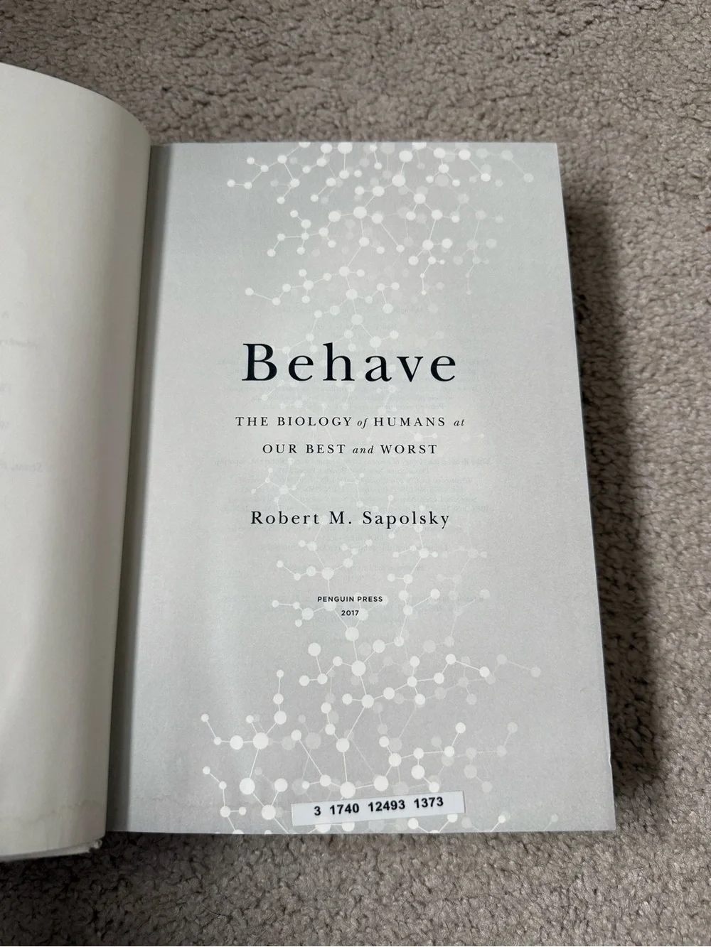 Behave by Robert M. Sapolsky - White & Green Hardcover